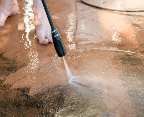 man-washing-dirty-backyard-tiles-with-high-pressur-2025-01-09-21-55-10-utc_11zon