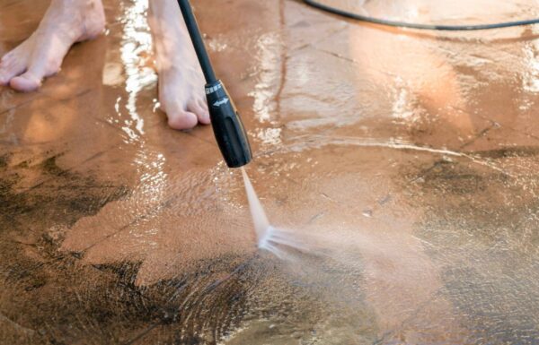 man-washing-dirty-backyard-tiles-with-high-pressur-2025-01-09-21-55-10-utc_11zon