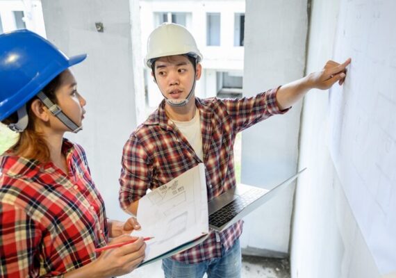 Engineer,Team,Discuss,And,Working,At,Construction,Property,Site.,Inspection